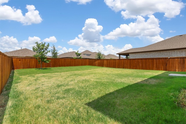 view of yard featuring a fenced backyard