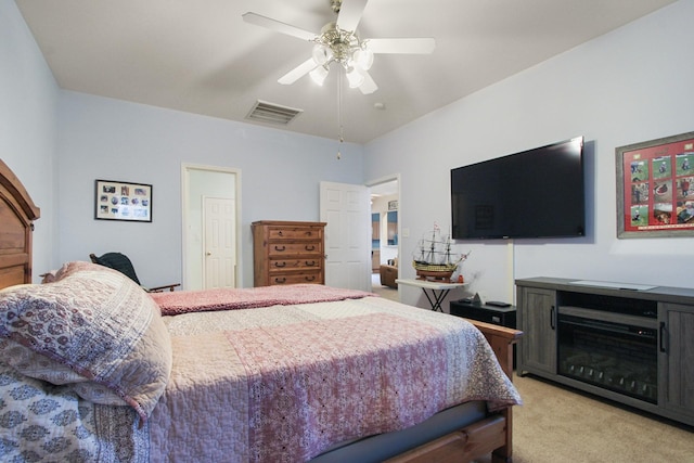 bedroom featuring visible vents, light colored carpet, and ceiling fan