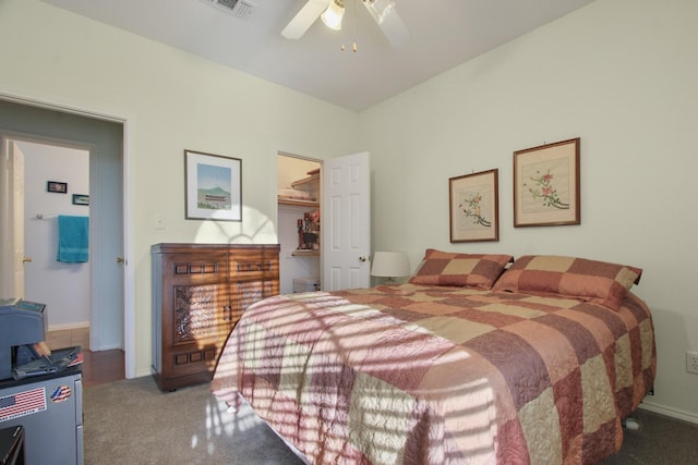 carpeted bedroom featuring a ceiling fan, visible vents, baseboards, a spacious closet, and a closet