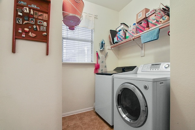 laundry room with tile patterned flooring, laundry area, independent washer and dryer, and baseboards