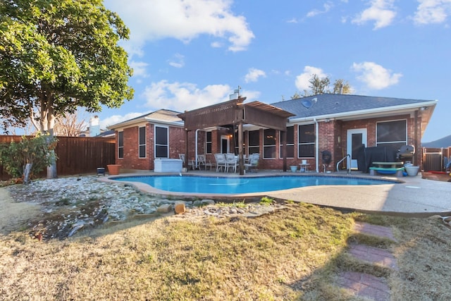 view of swimming pool with a fenced in pool, a patio, and fence