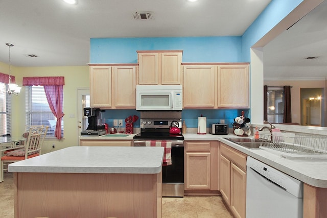 kitchen with light brown cabinetry, visible vents, and white appliances