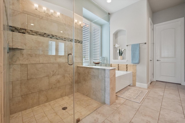 full bathroom with a shower stall and a garden tub