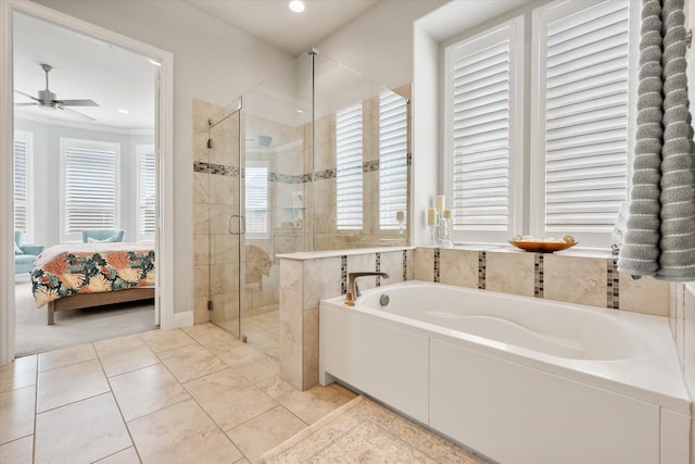 bathroom featuring a bath, plenty of natural light, a stall shower, and ensuite bath