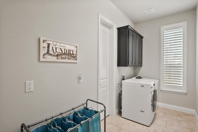 laundry area with washer and dryer, cabinet space, and baseboards