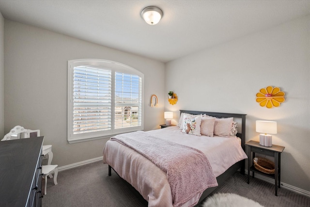 bedroom with carpet flooring and baseboards