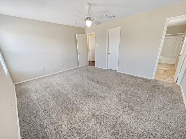 unfurnished bedroom featuring visible vents, baseboards, and carpet floors