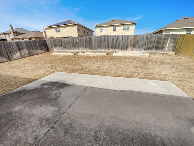 view of yard with a patio area and a fenced backyard