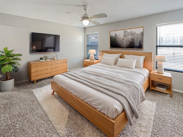 bedroom with baseboards, a ceiling fan, and carpet flooring