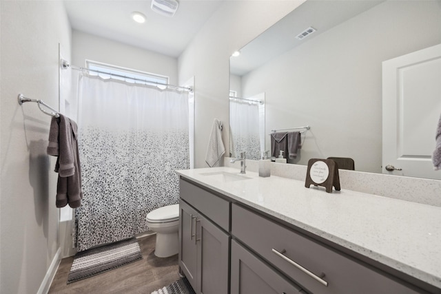 16032 Bronte Ln, Fort Worth, TX 76247 - bathroom featuring vanity, visible vents, toilet, and wood finished floors