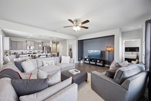 16032 Bronte Ln, Fort Worth, TX 76247 - living area featuring visible vents, baseboards, a ceiling fan, recessed lighting, and wood finished floors