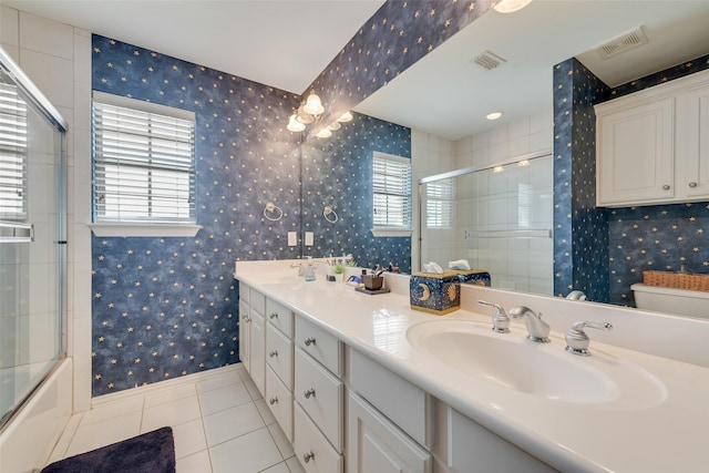 full bathroom featuring wallpapered walls, tile patterned floors, visible vents, and a sink