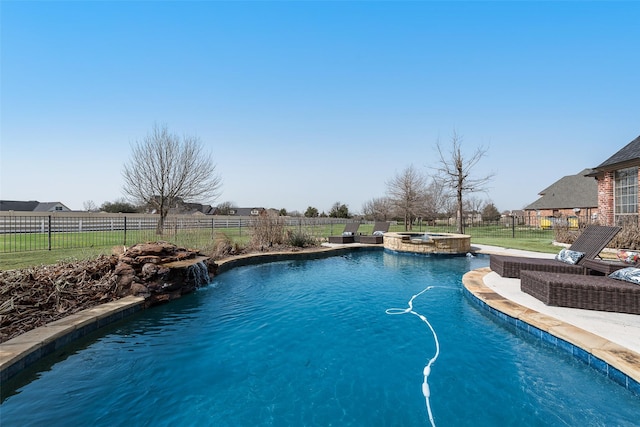 view of swimming pool with a patio, a fenced backyard, and a pool with connected hot tub