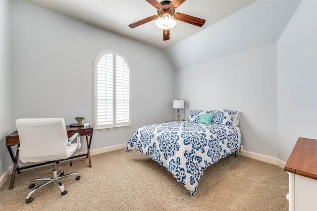 carpeted bedroom with baseboards, a ceiling fan, and vaulted ceiling