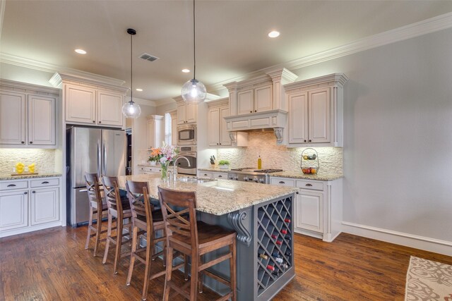 kitchen with tasteful backsplash, a breakfast bar, visible vents, stainless steel appliances, and ornamental molding