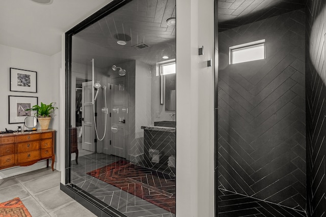 full bathroom with vanity, tile patterned floors, visible vents, and a stall shower