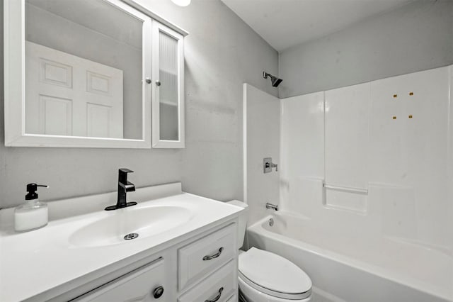 bathroom featuring toilet, vanity, and shower / tub combination