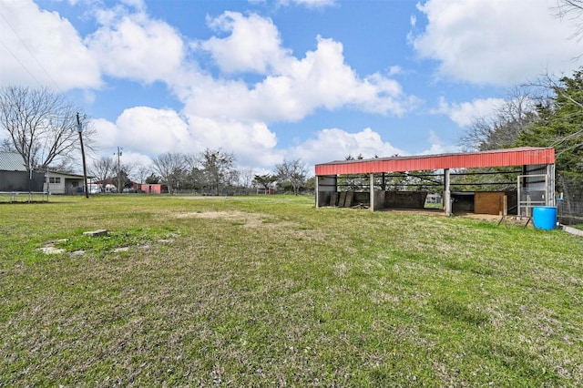 view of yard with an outbuilding and a trampoline