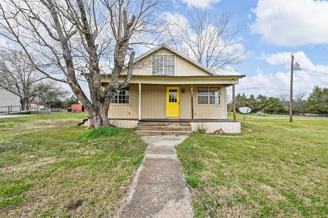 bungalow-style house featuring a front lawn and a porch