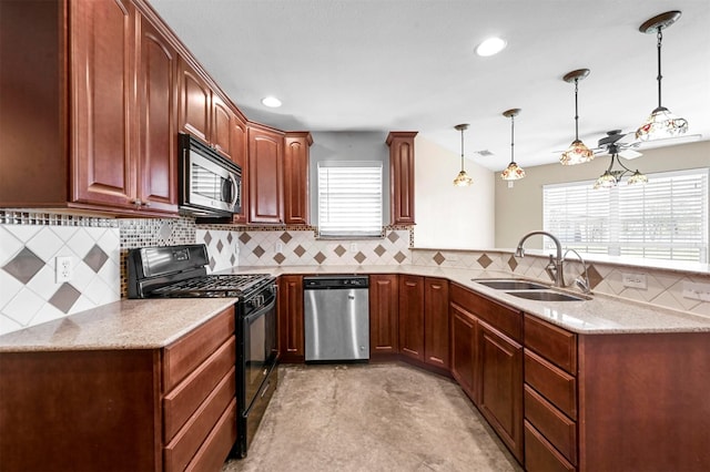 kitchen with tasteful backsplash, decorative light fixtures, a peninsula, stainless steel appliances, and a sink