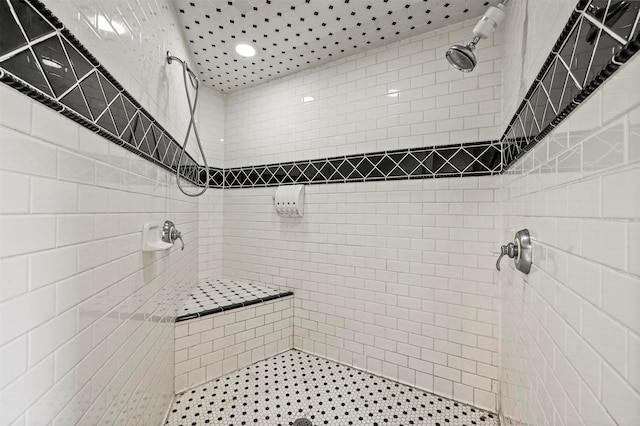 bathroom featuring tiled shower
