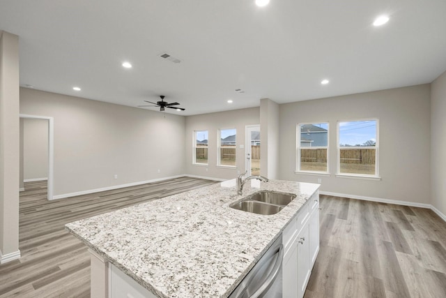 kitchen featuring visible vents, recessed lighting, a sink, white cabinets, and stainless steel dishwasher