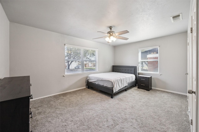 bedroom featuring carpet flooring, baseboards, and visible vents