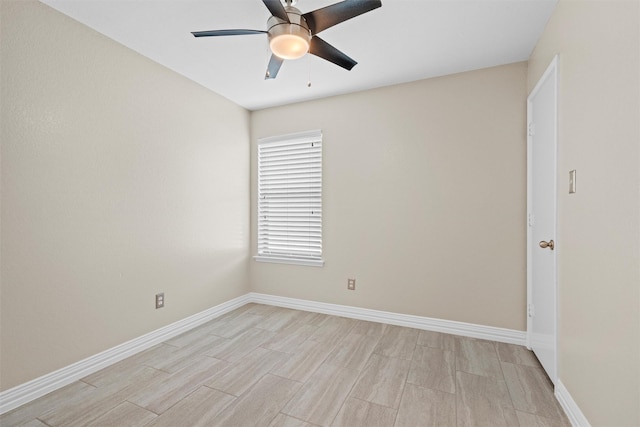 unfurnished room featuring light wood-style flooring, baseboards, and ceiling fan