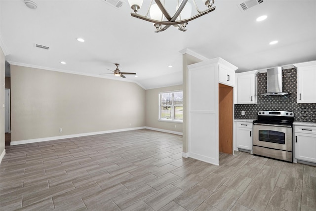 kitchen with visible vents, wall chimney range hood, ornamental molding, decorative backsplash, and stainless steel range with electric stovetop