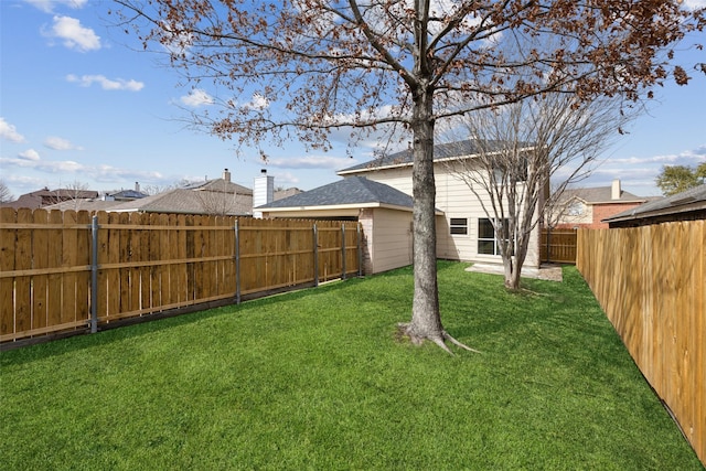 view of yard featuring a fenced backyard