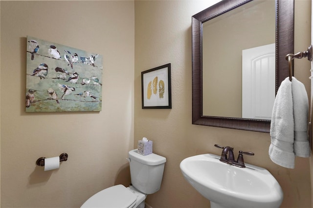 bathroom featuring a sink and toilet