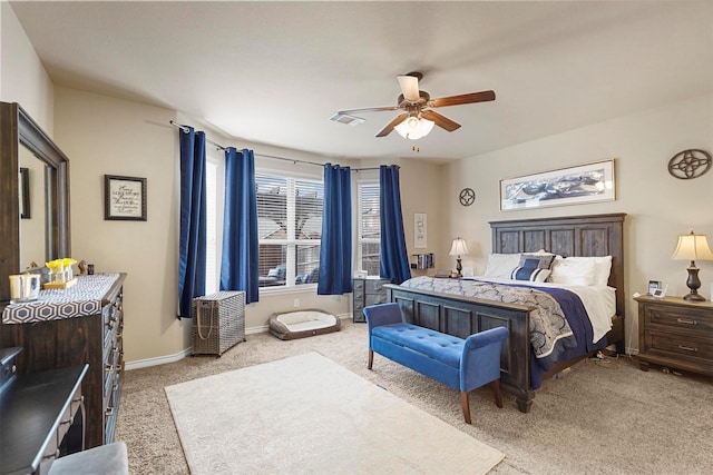 carpeted bedroom featuring visible vents, a ceiling fan, and baseboards