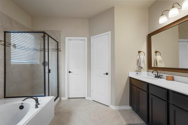 full bath with a shower stall, tile patterned flooring, baseboards, a bath, and vanity