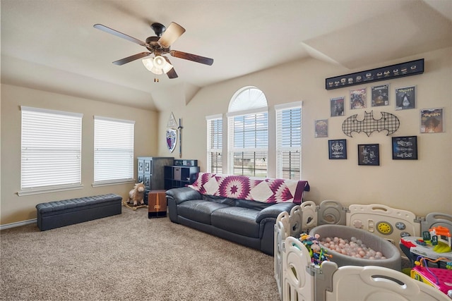 carpeted living room featuring a ceiling fan