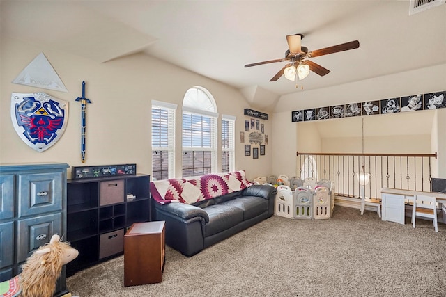 carpeted living area with visible vents, lofted ceiling, and ceiling fan