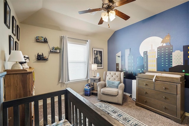 bedroom featuring baseboards, lofted ceiling, carpet floors, a view of city, and a ceiling fan