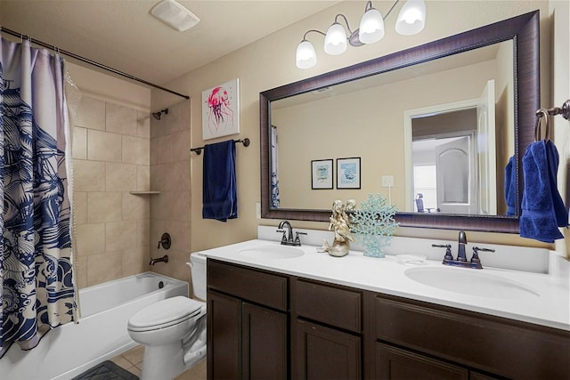 full bath with double vanity, toilet, shower / bath combo, and a sink