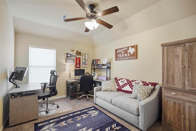 carpeted home office with baseboards, ceiling fan, and vaulted ceiling