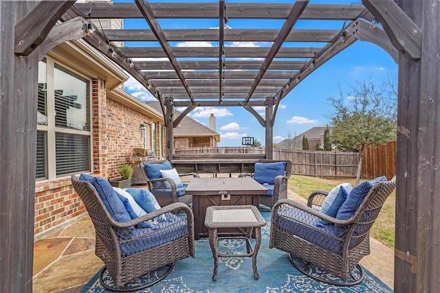 view of patio featuring an outdoor living space, a pergola, and fence