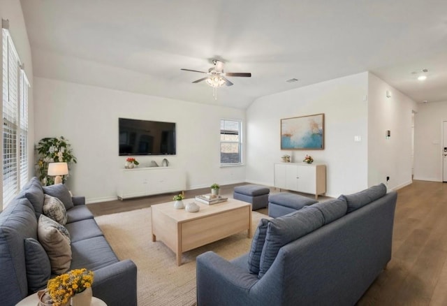 living room featuring a ceiling fan, wood finished floors, and baseboards