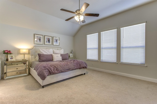 bedroom featuring carpet flooring, ceiling fan, baseboards, and vaulted ceiling