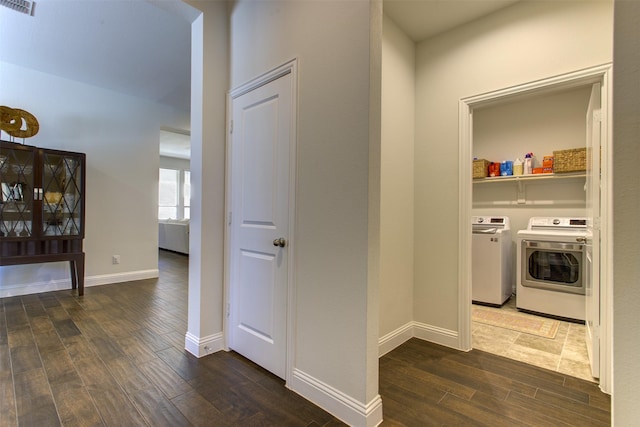 laundry area featuring laundry area, baseboards, visible vents, and dark wood-style flooring