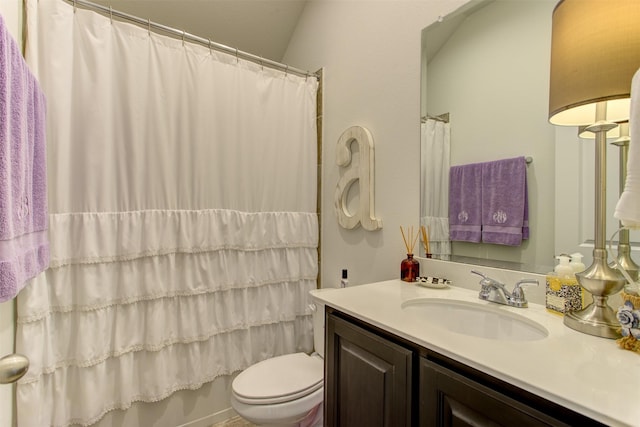 bathroom featuring vanity, toilet, and shower / bath combo with shower curtain