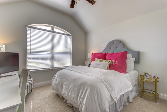 bedroom featuring vaulted ceiling, carpet, baseboards, and ceiling fan