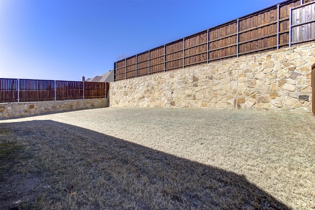 view of yard featuring a fenced backyard