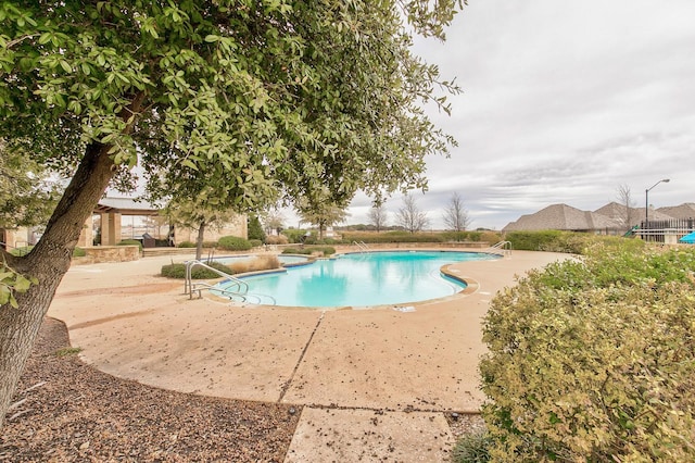 community pool featuring a patio