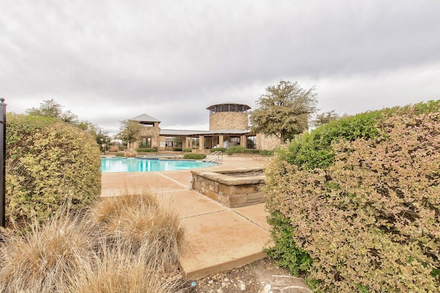 outdoor pool featuring a patio