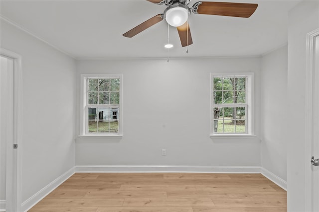 empty room with baseboards, light wood-style flooring, and a ceiling fan