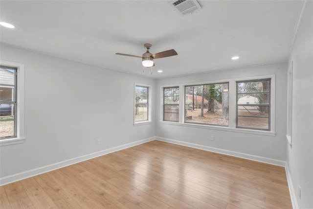 empty room with recessed lighting, baseboards, visible vents, and light wood-type flooring