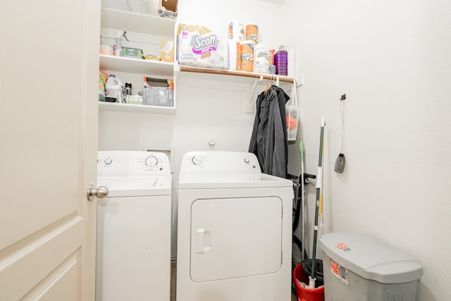 laundry area with washing machine and clothes dryer and laundry area